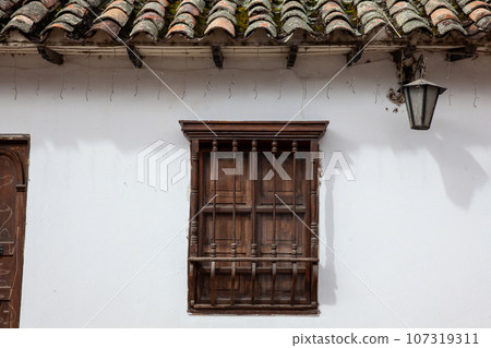 Detail of the beautiful colonial architecture of the streets of the colonial small town of Iza located in the Boyaca department in Colombia Detail of the beautiful colonial architecture of the streets of the colonial small town of Iza located in the Boyaca department in Colombia 107319311