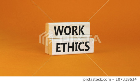 Work ethics symbol. Concept words Work ethics on beautiful wooden block. Beautiful orange table orange background. Business and Work ethics concept. Copy space. Work ethics symbol. Concept words Work ethics on beautiful wooden block. Beautiful orange table orange background. Business and Work ethics concept. Copy space. 107319634