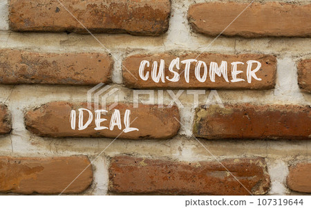 Ideal customer symbol. Concept words Ideal customer on beautiful brick wall. Beautiful red brown brick wall background. Business ideal customer concept. Copy space. Ideal customer symbol. Concept words Ideal customer on beautiful brick wall. Beautiful red brown brick wall background. Business ideal customer concept. Copy space. 107319644