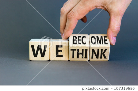 We become or think symbol. Concept word We think We become on wooden cubes. Beautiful grey table grey background. Businessman hand. Business we become or think concept. Copy space. We become or think symbol. Concept word We think We become on wooden cubes. Beautiful grey table grey background. Businessman hand. Business we become or think concept. Copy space. 107319686