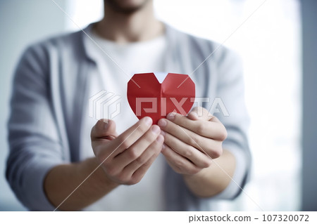 Hands holding red heart. Health care. Organ donation. World Heart Day. World Health Day. World Mental Health Day Hands holding red heart. Health care. Organ donation. World Heart Day. World Health Day. World Mental Health Day 107320072