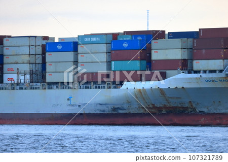 Container ship leaving port Container ship leaving port 107321789
