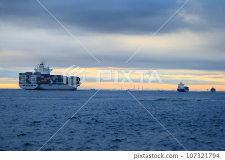 Container ship leaving port 107321794