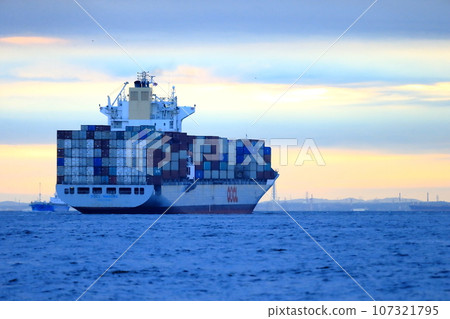 Container ship leaving port 107321795