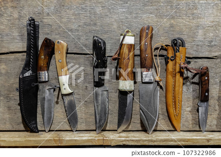sharp paring knife on a distressed grunge wooden table 107322986