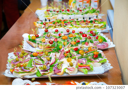 many different snacks on big plates many different snacks on big plates 107323007
