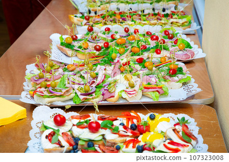 many different snacks on big plates many different snacks on big plates 107323008