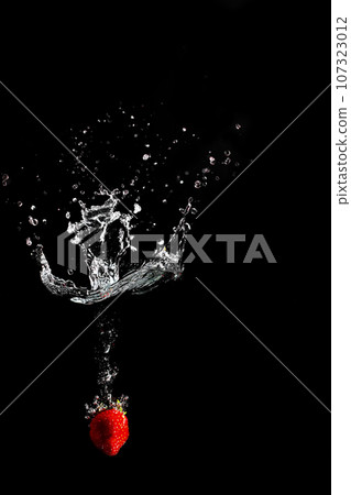 bright juicy fruits with splashes on black background. bright juicy fruits with splashes on black background. 107323012