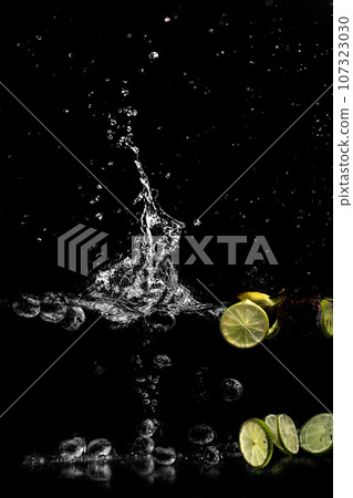bright juicy fruits with splashes on black background. bright juicy fruits with splashes on black background. 107323030