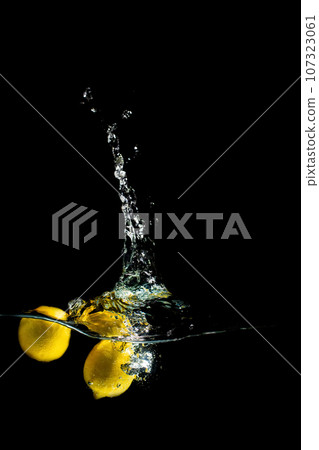 bright juicy fruits with splashes on black background. bright juicy fruits with splashes on black background. 107323061