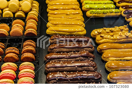 many of  colorful cakes are on display 107323080