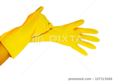 female hands in yellow gloves female hands in yellow gloves 107323088