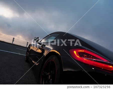 Black sports car bathing in the morning sun 107323256