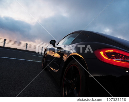 Black sports car bathing in the morning sun 107323258
