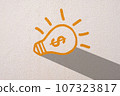 Abstract orange thinking light bulb on concrete wall background 107323817