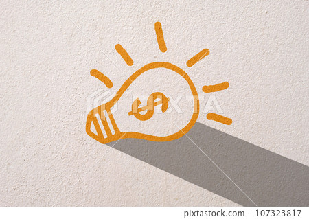 Abstract orange thinking light bulb on concrete wall background Abstract orange thinking light bulb on concrete wall background 107323817