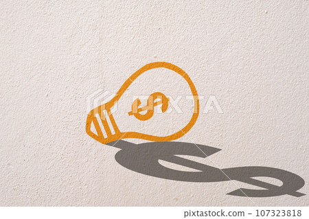 Abstract orange thinking light bulb and dollar shadow on concrete wall background Abstract orange thinking light bulb and dollar shadow on concrete wall background 107323818