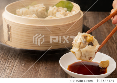 Shumai fried chopsticks with soy sauce 107327425
