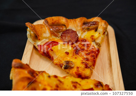 lice of pizza cheese lunch or dinner crust seafood meat topping sauce. delicious tasty fast food in side view. lice of pizza cheese lunch or dinner crust seafood meat topping sauce. delicious tasty fast food in side view. 107327550