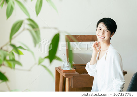 Adult woman taking care of her skin and relaxing Adult woman taking care of her skin and relaxing 107327793