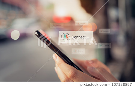 Hands holding smartphone with using a application connect on mobile and comment to communicate. 107328897