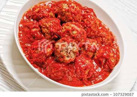 Iowa Ham Balls with tomato sauce in bowl Iowa Ham Balls with tomato sauce in bowl 107329087