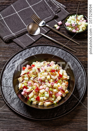 Sweet Apple Salad with celery, marshmallows, pecan Sweet Apple Salad with celery, marshmallows, pecan 107329094