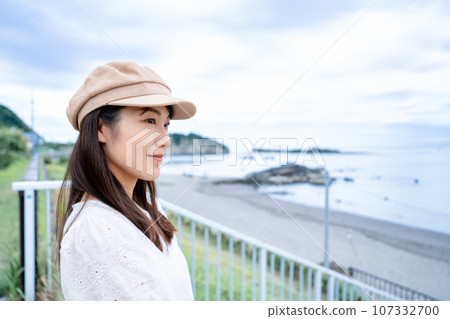 Woman looking at the sea Woman looking at the sea 107332700