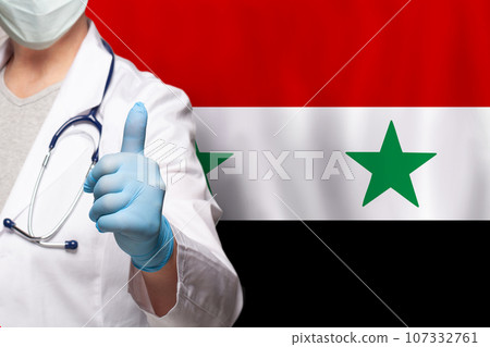 Syrian doctor's hand showing thumb up positive gesture on flag of Syria background 107332761