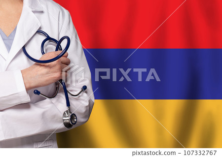Armenian medicine and healthcare concept. Doctor close up against flag of Armenia background 107332767