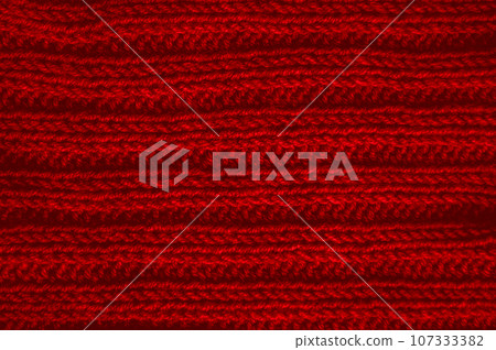 Handmade knit background with macro wool threads. Handmade knit background with macro wool threads. 107333382