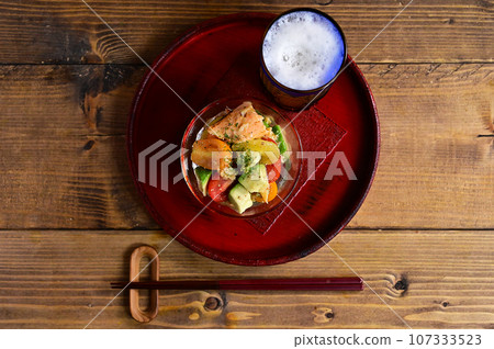 Marinated grilled salmon, tomatoes and avocado Marinated grilled salmon, tomatoes and avocado 107333523