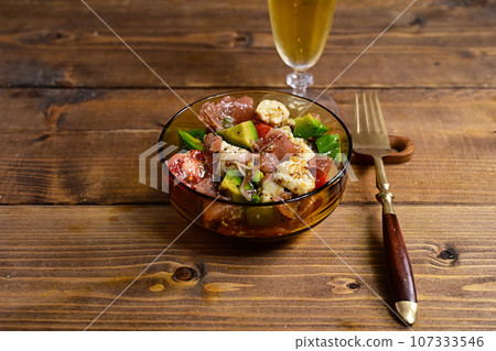 Marinated prosciutto, avocado, tomato and camembert cheese Marinated prosciutto, avocado, tomato and camembert cheese 107333546