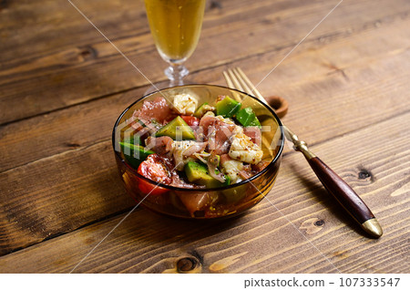 Marinated prosciutto, avocado, tomato and camembert cheese Marinated prosciutto, avocado, tomato and camembert cheese 107333547