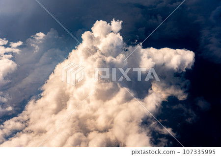Cumulonimbus clouds aerial photography airplane sunset evening afternoon airplane flight travel tourism inbound Cumulonimbus clouds aerial photography airplane sunset evening afternoon airplane flight travel tourism inbound 107335995