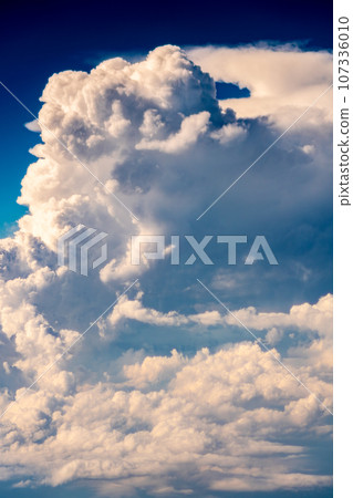 Cumulonimbus clouds aerial photography airplane sunset evening afternoon airplane flight travel tourism inbound Cumulonimbus clouds aerial photography airplane sunset evening afternoon airplane flight travel tourism inbound 107336010