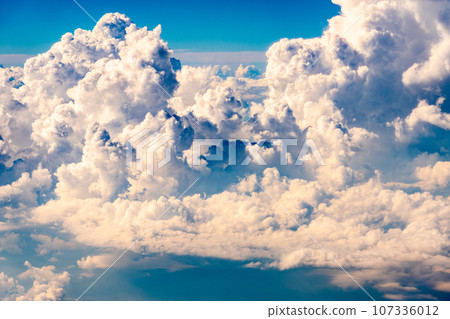 Cumulonimbus clouds aerial photography airplane sunset evening afternoon airplane flight travel tourism inbound 107336012