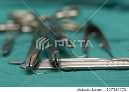 Three needle holders and empty needles 107336270