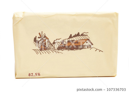 Stick of wrapped butter isolated on white background 107336703