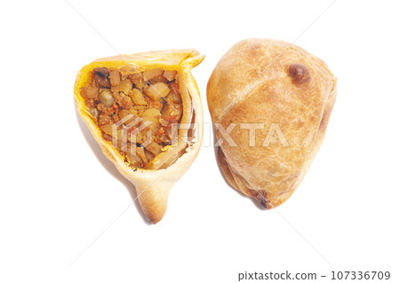 Indian samosa isolated on white background. Indian samosa isolated on white background. 107336709