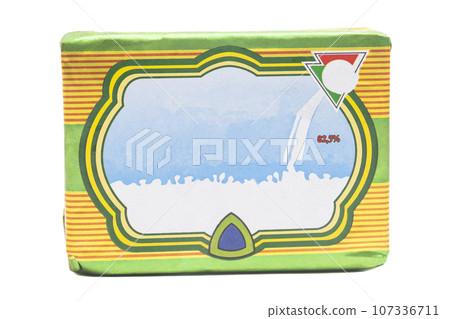 Stick of wrapped butter isolated on white background Stick of wrapped butter isolated on white background 107336711