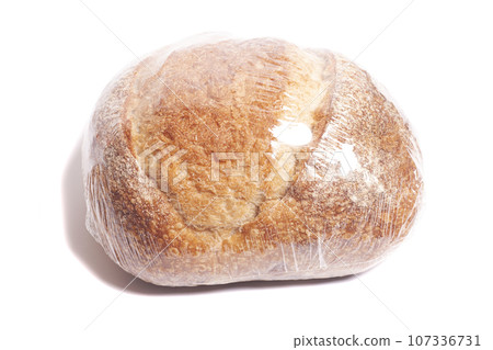 Bread tartine on wheat sourdough in a package isolated on white background. Bread tartine on wheat sourdough in a package isolated on white background. 107336731