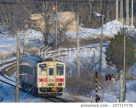 Hanasaki Line vehicles running on winter-snowy routes in Nemuro, Hokkaido / Nemuro, Hokkaido, Japan 107337576