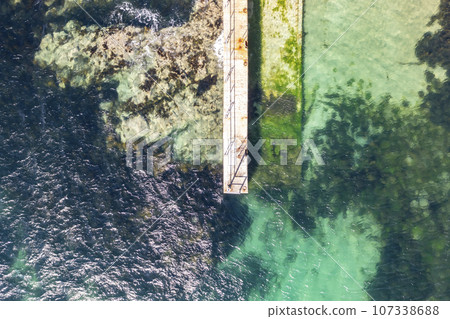 Aerial view of the north west pier on Cruit Island, Tobernoran, bay, County Donegal, Ireland 107338688