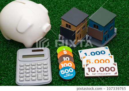 Image of a three-story house model and savings Image of a three-story house model and savings 107339765
