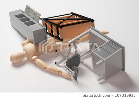 Doll trapped under furniture that collapsed in the earthquake 107339935