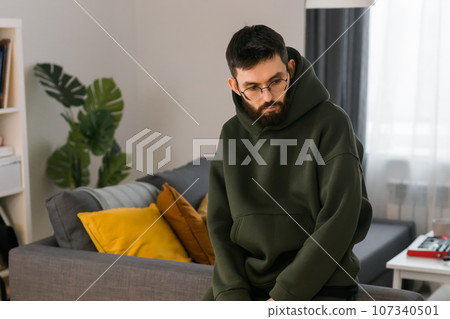 Sad man pondering about his life after a relationship breakup or bipolar disorder copy space - depression asthenia , mental problem and anxiety disorder concept 107340501