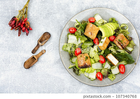 Salad with fresh vegetables and cheese. Salad with fresh vegetables and cheese. 107340768