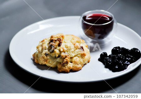 scone with berry sauce and berry juice scone with berry sauce and berry juice 107342059