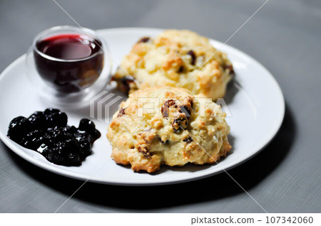 scone with berry sauce and berry juice scone with berry sauce and berry juice 107342060